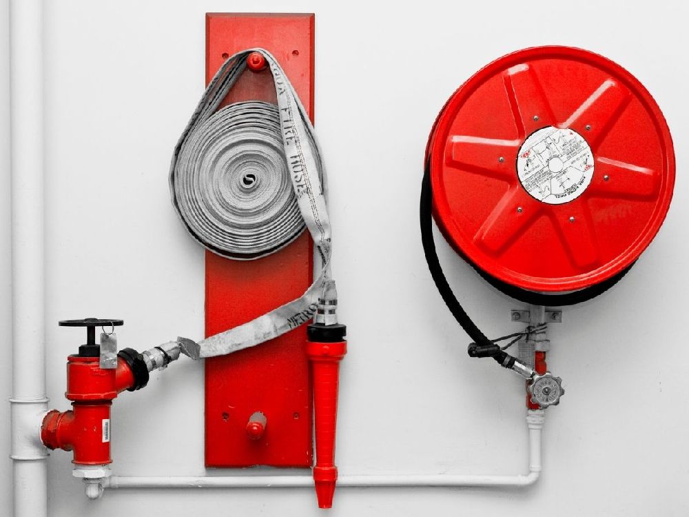 a fire hose reel as part of office fire equipment of a larger building